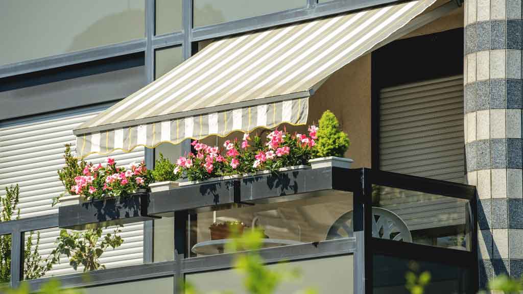Awning installers fitting a new awning, Central Coast