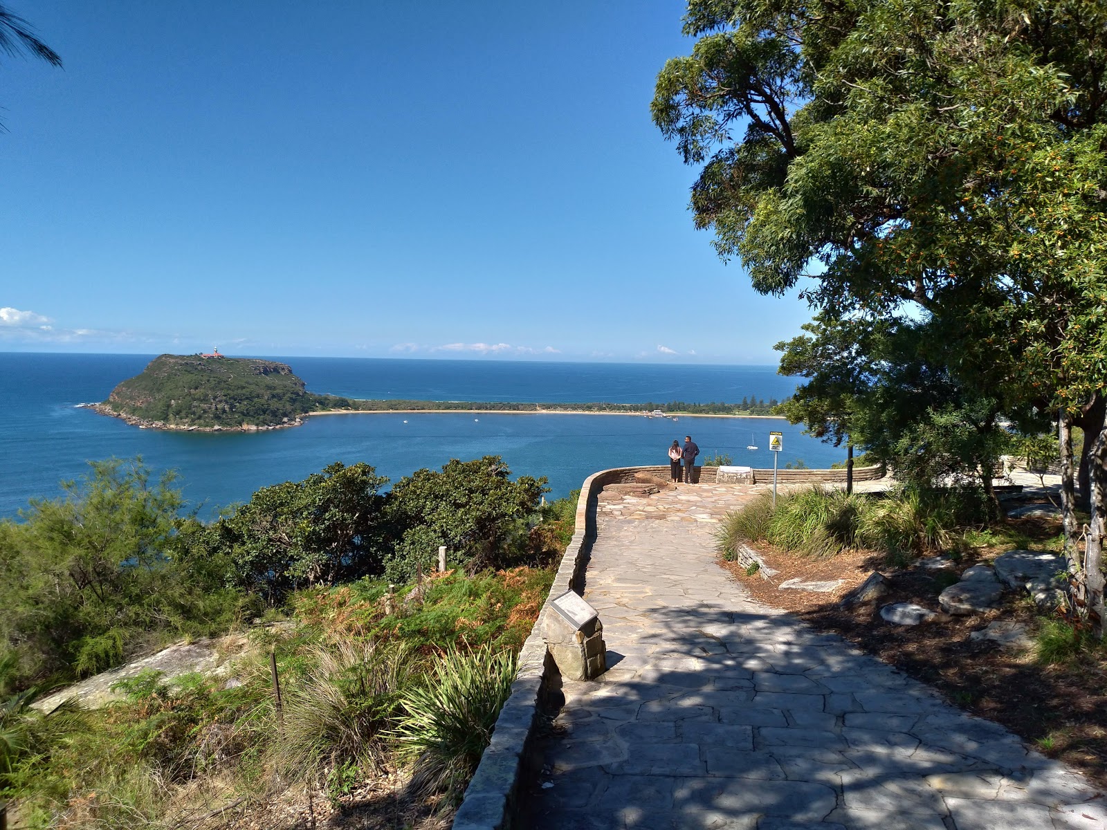 Paved viewing platform at West Head Lookout overlooking Barrenjoey Head across the water